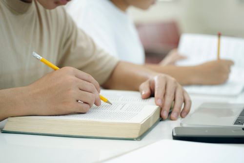 Student studing with having notebook and pancel